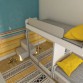 Colorato łóżko piętrowe z szafą i lustrem